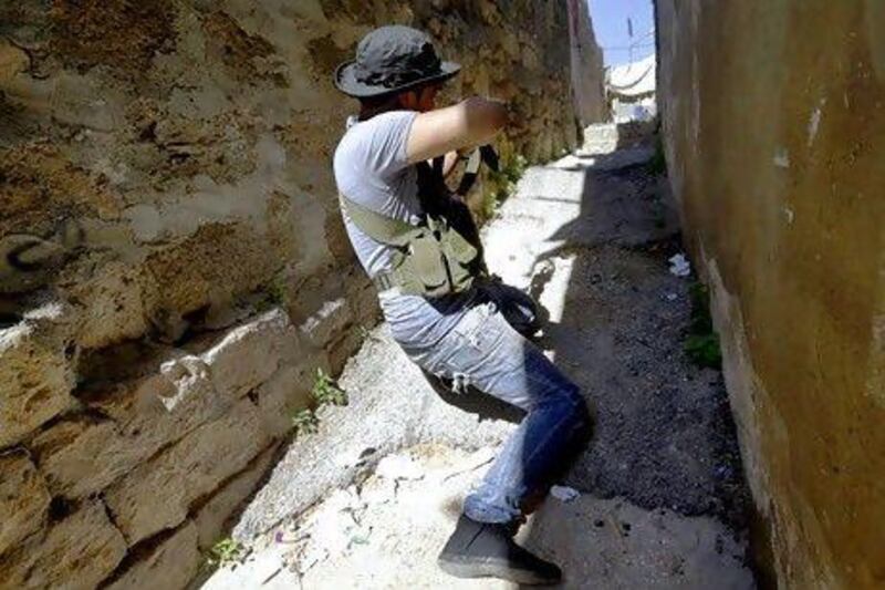 A Sunni fighter during clashes between pro- and anti-Syrian regime gunmen in Tripoli, Lebanon, on Friday.