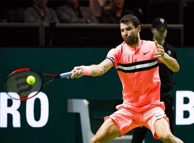 Grigor Dimitrov of Bulgaria plays a forehand return to Roger Federer of Switzerland during their men's singles final for the ABN AMRO World Tennis Tournament in Rotterdam on February 18, 2018.  / AFP PHOTO / ANP / Koen Suyk / Netherlands OUT