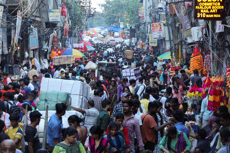 People shop at a crowded market ahead of Diwali in the old quarters of Delhi. Reuters