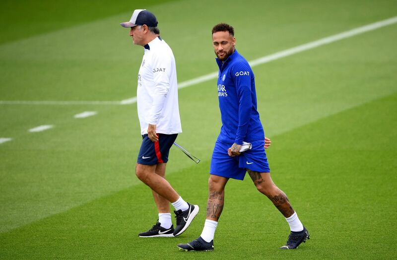 PSG manager Christophe Galtier, left, and Neymar arrive for a training session at the club's training ground in Saint-Germain-en-Laye on Tuesday, September 13, 2022. AFP