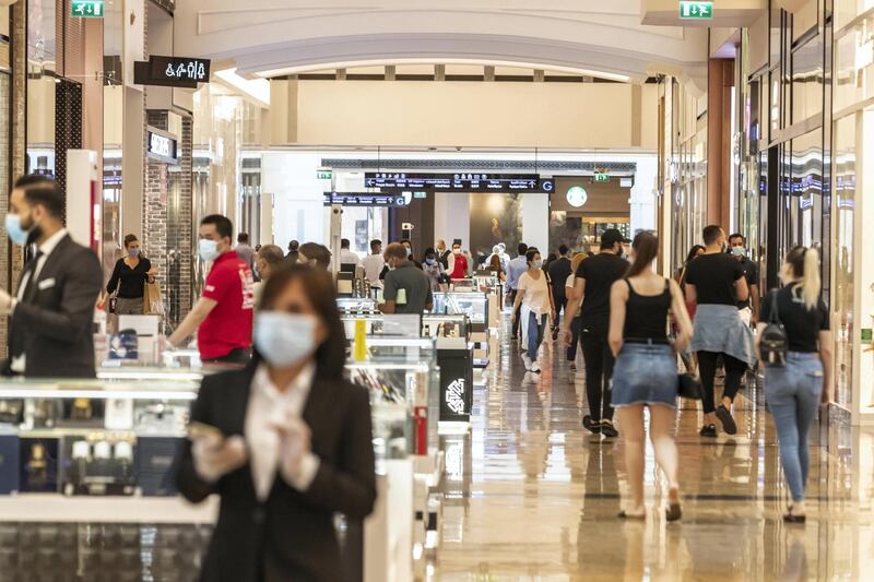 DUBAI, UNITED ARAB EMIRATES. 24 MAY 2020. The first day of the Eid holidays saw shoppers head to Mall of the Emirates to shop for both food and luxury items. Mall staff have put in place thermal scanning at entry ways and shops are supplying hand santizer and in some cases glothes when shoppers enter the stores. Social distancing is also being observed for the most part as restrictions are in place by Dubai Government. (Photo: Antonie Robertson/The National) Journalist: Kelly Clarke. Section: National.