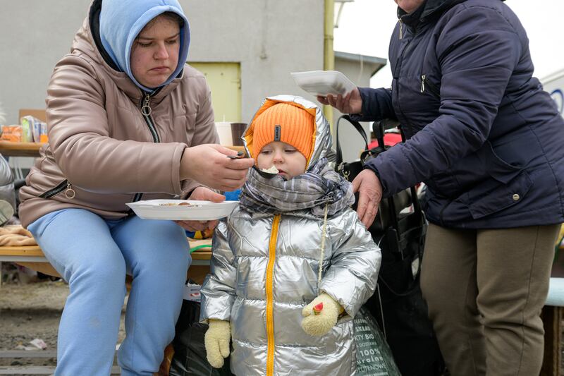 Veronika feeds her son Aleksander at the temporary refugee station in Medyka, eastern Poland. Photo: DEC