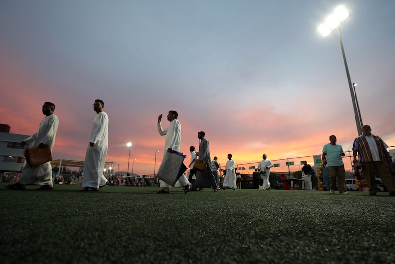 Muslims gather to perform prayers on the first day of Eid Al Fitr