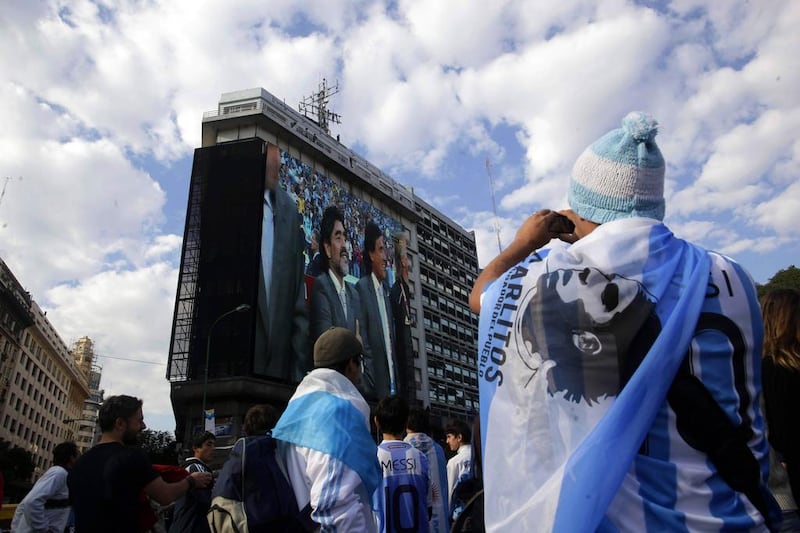 Argentina fans watch former Al Wasl manager Maradona on a big screen ahead of a national match. Argentina has so far sold 53,809 tickets, 3.6 per cent of the overall total. Natacha Pisarenko / AP Photo