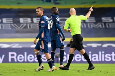 Arsenal's Nicolas Pepe (centre) is sent off after being shown a red card by referee Anthony Taylor during the Premier League match at Elland Road, Leeds. PA Photo. Picture date: Sunday November 22, 2020. See PA story SOCCER Leeds. Photo credit should read: Michael Regan/PA Wire. RESTRICTIONS: EDITORIAL USE ONLY No use with unauthorised audio, video, data, fixture lists, club/league logos or "live" services. Online in-match use limited to 120 images, no video emulation. No use in betting, games or single club/league/player publications.