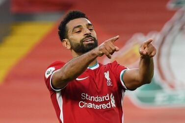 Soccer Football - Premier League - Liverpool v Leeds United - Anfield, Liverpool, Britain - September 12, 2020 Liverpool's Mohamed Salah celebrates scoring their fourth goal to complete his hat-trick. Pool via REUTERS/Shaun Botterill EDITORIAL USE ONLY. No use with unauthorized audio, video, data, fixture lists, club/league logos or 'live' services. Online in-match use limited to 75 images, no video emulation. No use in betting, games or single club/league/player publications. Please contact your account representative for further details.