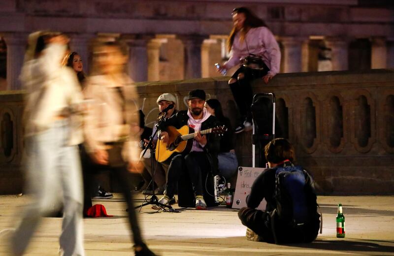 People enjoy an evening with spring-like temperatures in Berlin, Germany. Reuters