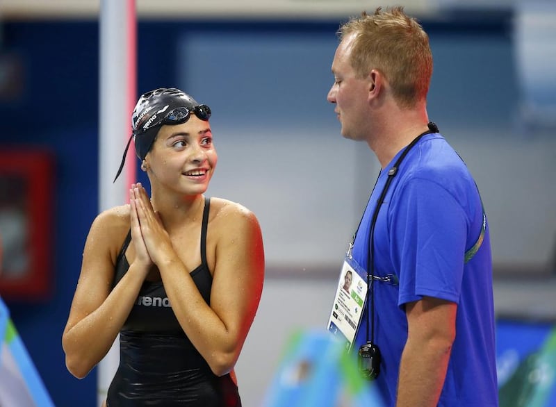 Refugee team swimmer Yusra Mardini, 18, from Syria with her German coach Sven Spannekrebs at the Olympic swimming venue in Rio de Janeiro, August 4, 2016. Michael Dalder / Reuters.