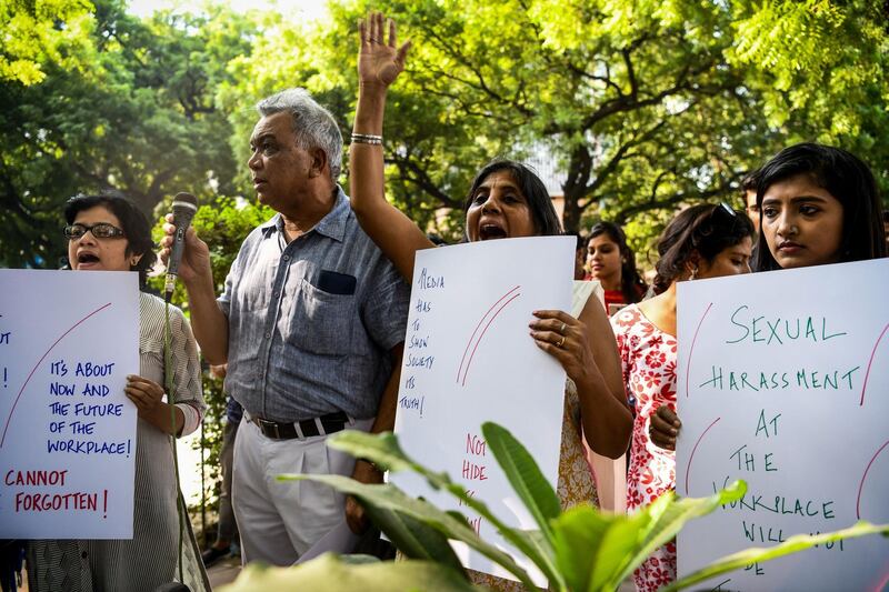 Indian journalists hold placard at a protest against sexual harassment in the media industry in New Delhi on October 13, 2018. India's #MeToo movement has engulfed Bollywood figures, a government minister and several comedians and top journalists. / AFP / CHANDAN KHANNA
