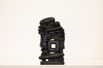 Chaouki Choukini’s bronze sculpture calls to mind an unsteady stack of books by a bedside. Anna Shtraus