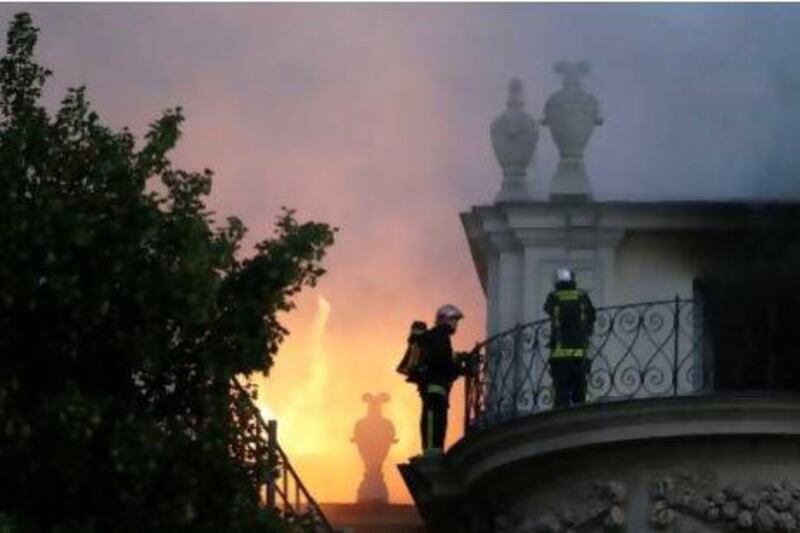 Firemen fight a blaze at the 17 century Hotel Lambert in Paris.
