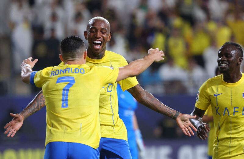 Talisca with Cristiano Ronaldo after scoring Al Nassr's first goal against Al Duhail. AFP