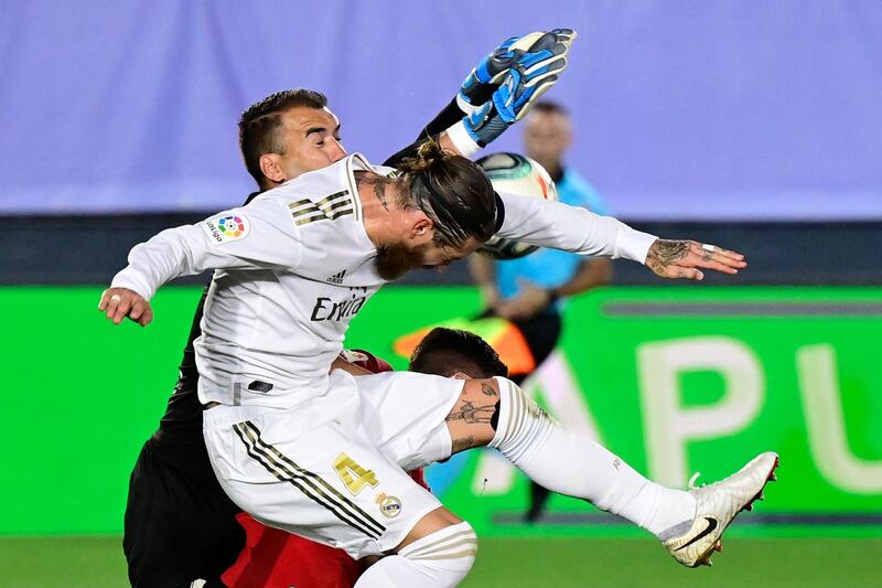 Sergio Ramos challenges Mallorca goalkeeper Manolo Reina. AFP