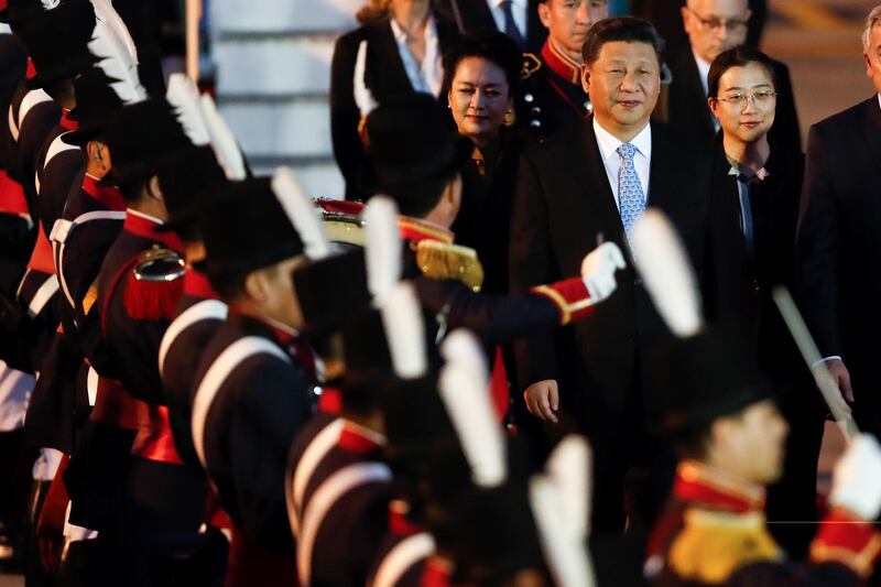 Chinese President Xi Jinping and First Lady Peng Liyuan arrive at the Ezeiza International Airport on Thursday. EPA