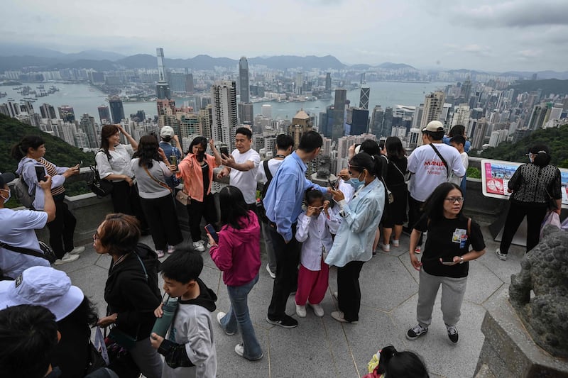 Tourists visit the Peak on the Labour Day holiday in Hong Kong. AFP