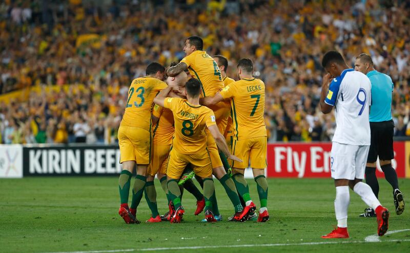 Australian players celebrate their first goal against Honduras. Daniel Munoz / AP Photo