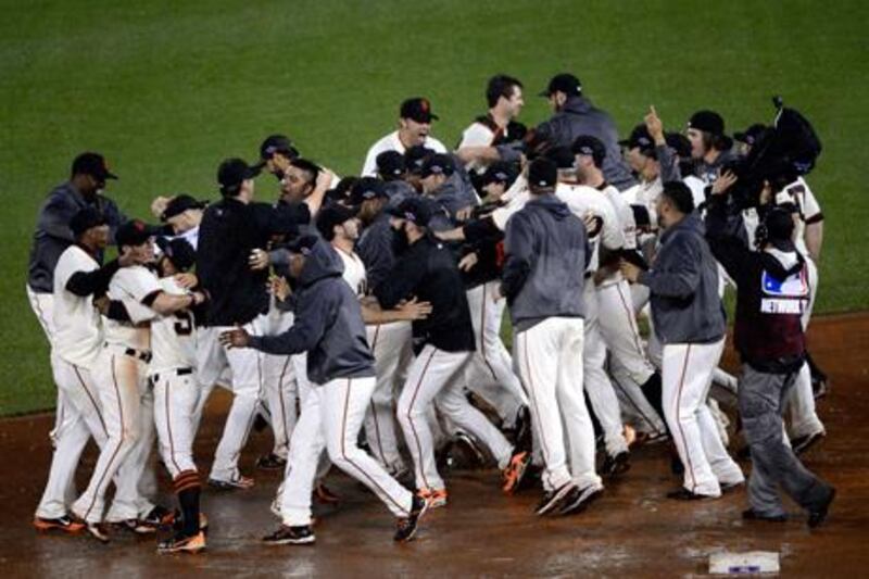 The San Francisco Giants celebrate after advancing to the World Series with a 9-0 win against St Louis to take their championship series