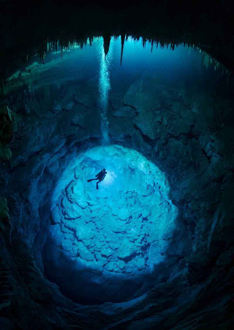 Second place, Portfolio, Martin Broen. A diver descends into the 'Blue Abyss' sinkhole, which sits within an underwater cave system.