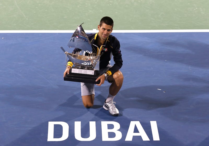 Novak Djokovic of Serbia with the trophy after winning the Dubai Duty Free Tennis Championships in Dubai, United Arab Emirates, Saturday, March 2, 2013. (AP Photo/Regi Varghese) *** Local Caption ***  Mideast Emirates Dubai Tennis Championships.JPEG-0eebd.jpg