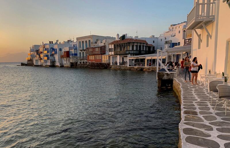 Visitors sit in bars in an area known as Little Venice on the Greek island of Mykonos.