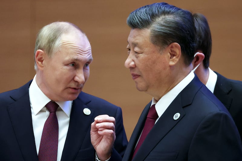 Russian President Vladimir Putin, left, meets Chinese President Xi Jinping at the Shanghai Co-operation Organisation summit in Samarkand, Uzbekistan, on Friday. AP Photo