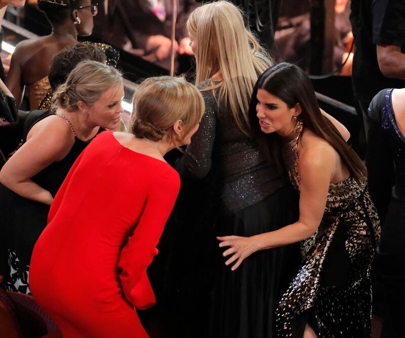 Allison Janney and Sandra Bullock are either in intense conversation or are playing hide and seek. Reuters