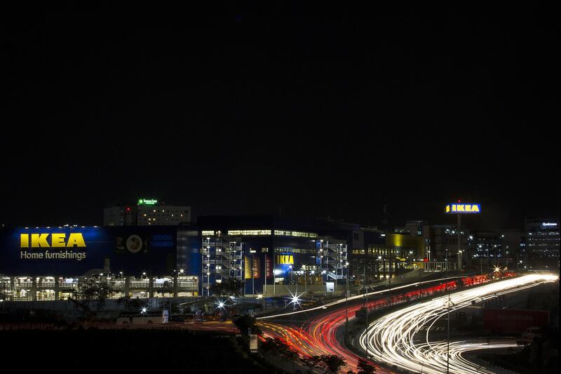 Light trails left from passing traffic run past the Ikea retail store at night in Hitech City on the outskirts of Hyderabad, India, on Wednesday, Aug. 8, 2018. In a milestone that's been more than a decade in the making, India's first Ikea store opened today, bringing inexpensive Nordic-inspired furnishings and food to the worlds fastest-growing middle class. Photographer: Udit Kulshrestha/Bloomberg