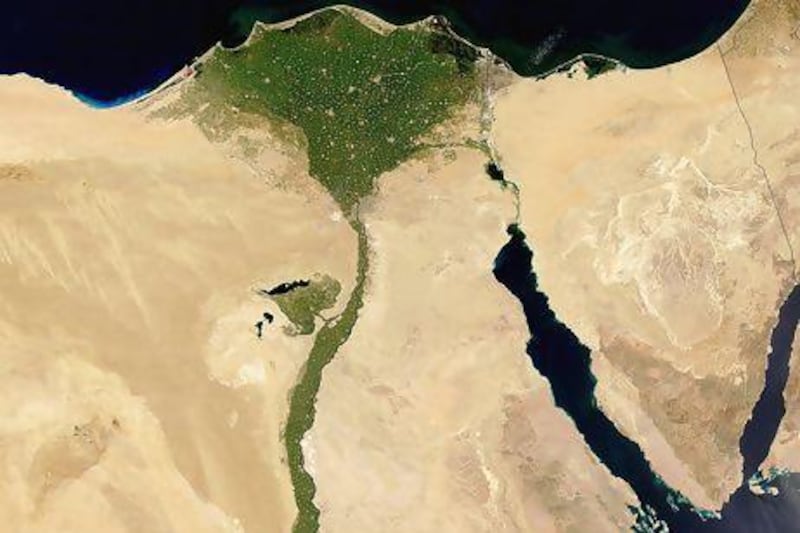 A Nasa satellite image shows the Nile during its peak summer green in mid-July. The Nile drains one-tenth of the African continent. Nasa / AFP