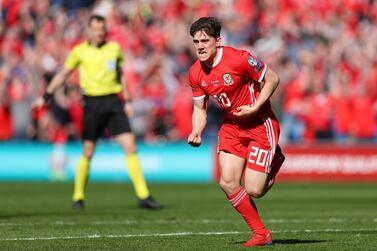 Dan James of Wales celebrates after he scores against Slovakia in Cardiff on Sunday. Catherine Ivill / Getty Images