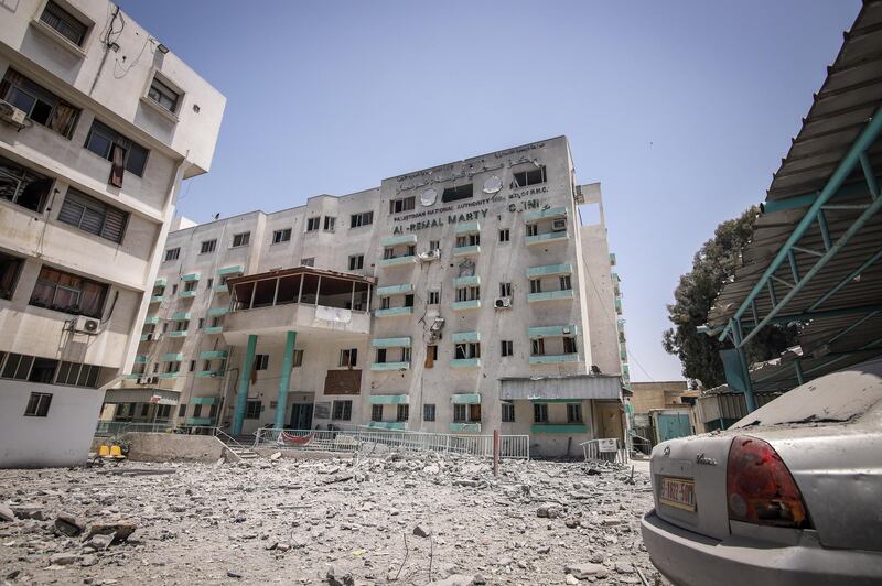 Debris lies scattered in front of Al Remal Clinic, Gaza's sole Covid-19 testing laboratory, following Israeli air strikes in Gaza City.  Bloomberg