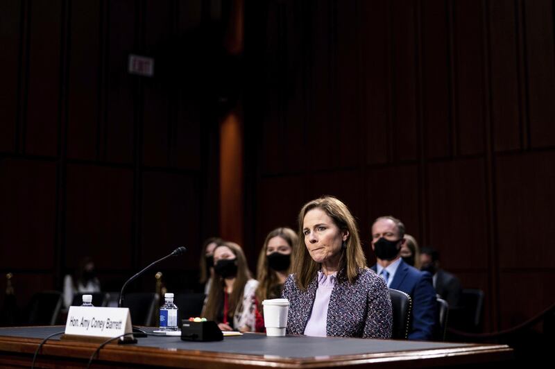 FILE - In this Oct. 14, 2020, file photo, Supreme Court nominee Amy Coney Barrett listens during a confirmation hearing before the Senate Judiciary Committee on Capitol Hill in Washington. Barrett served for nearly three years on the board of a private Christian school that effectively barred admission to children of same-sex parents and made it plain openly gay and lesbian teachers werenâ€™t welcome in the classroom. (Erin Schaff/The New York Times via AP, Pool, File)
