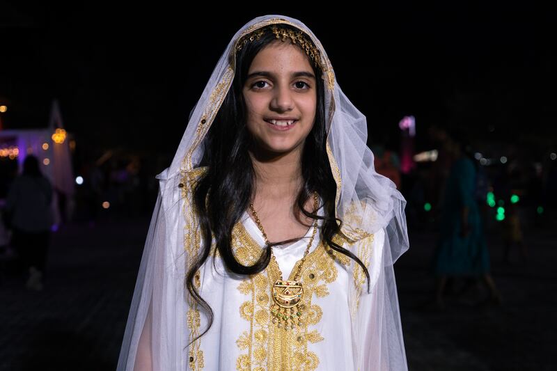 Fatma Almulla's daughter, 11, wears the traditional tassel head jewellery for Garangao in Doha