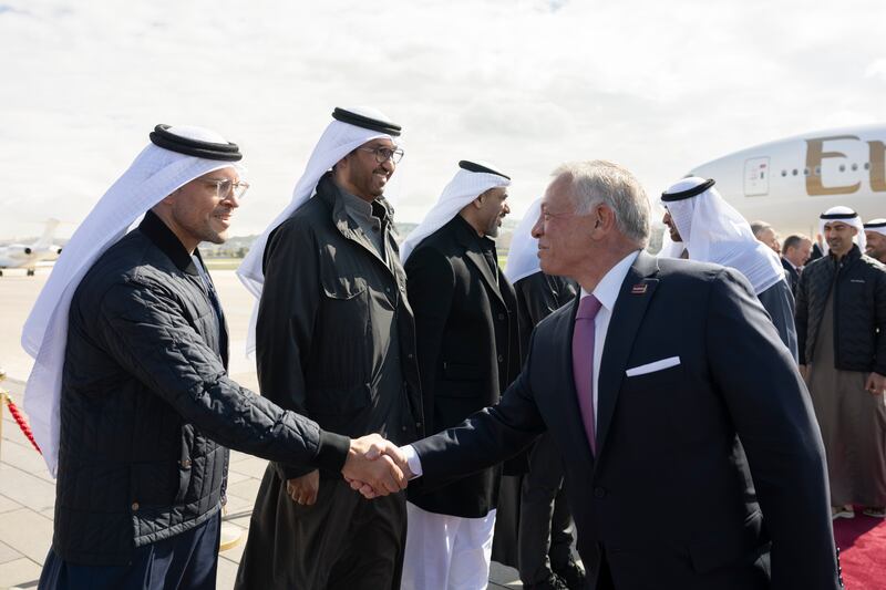 Mohamed Al Shorafa, chairman of the Department of Municipalities and Transport, greets King Abdullah at Marka International Airport.