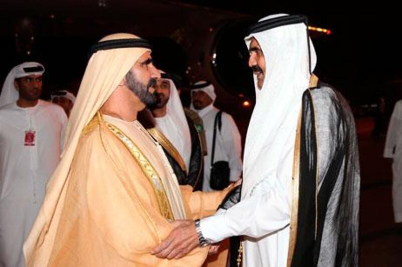 Sheikh Mohammed bin Rashid, Vice President of the UAE and Ruler of Dubai, is greeted by Qatar's emir, Sheikh Hamad bin Khalifa Al Thani, in Doha on Monday. WAM / Reuters