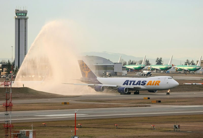 Water is sprayed above the final 747 airplane produced by Boeing.  AFP