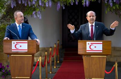 Turkish-Cypriot leader Ersin Tatar (R) speaks during a joint press conference with Turkey's Foreign Minister Mevlut Cavusoglu in the northern part of Cyprus' divided capital Nicosia, under control of the self-proclaimed Turkish Republic of North Cyprus (TRNC), on April 16, 2021. / AFP / Birol BEBEK
