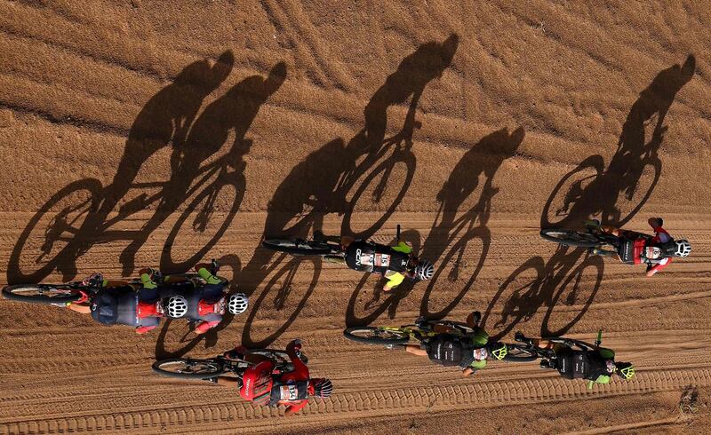Competitors ride their bikes during Stage 4 of the 14th edition of Titan Desert 2019 mountain biking race between Merzouga and M’ssici, in Morocco.  AFP