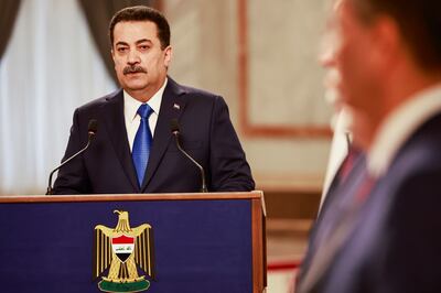Iraqi Prime Minister Mohammed Shia Al Sudani speaks during a December press conference. AP