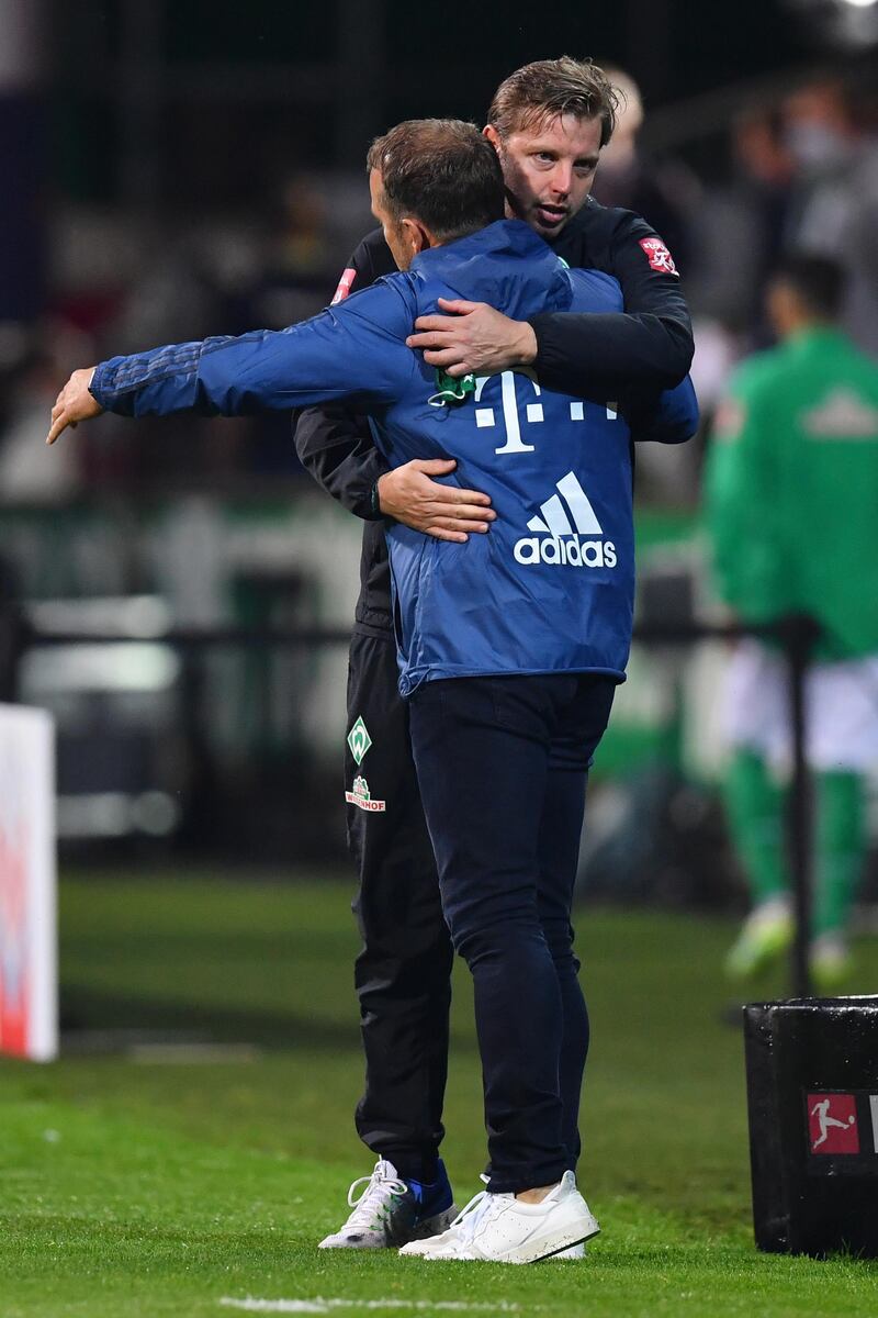 Werder Bremen coach Florian Kohfeldt (top), congratulates Bayern coach Hans-Dieter Flick. EPA