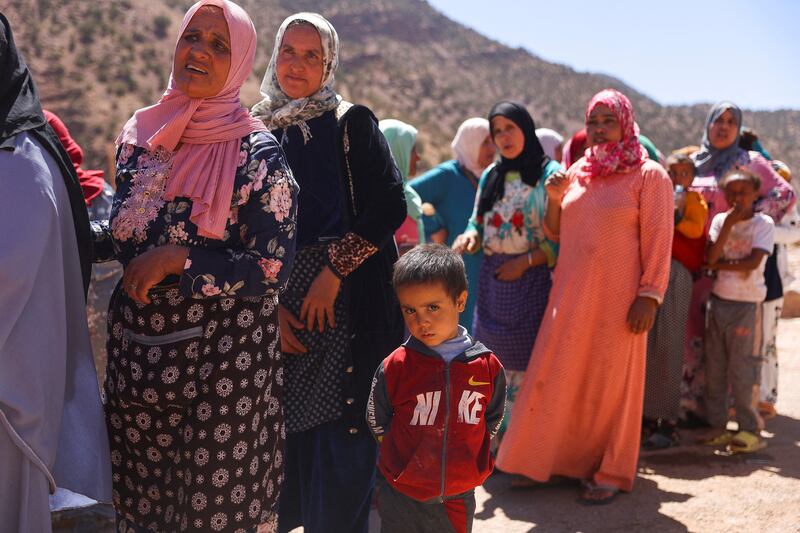 Earthquake survivors queue for aid in Tinmel, Morocco, on Monday. Reuters