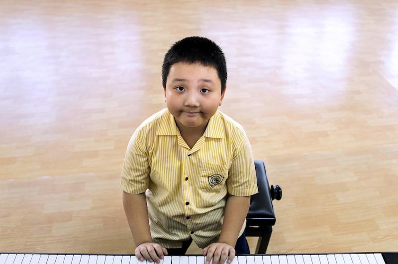 Xiaolin Zhang at Horizon School. He won this year's BSME Young Musicians of the Gulf competition, for the second time in a row. Reem Mohammed / The National 

￼￼￼￼￼￼￼￼￼￼