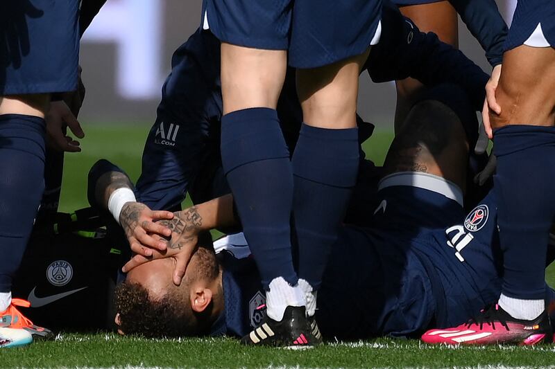 Paris Saint-Germain's Neymar lies injured. AFP