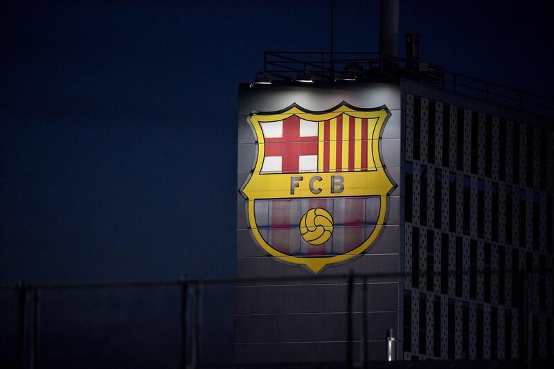 This photo shows the FC Barcelona's logo displayed on a building during a training session. AFP