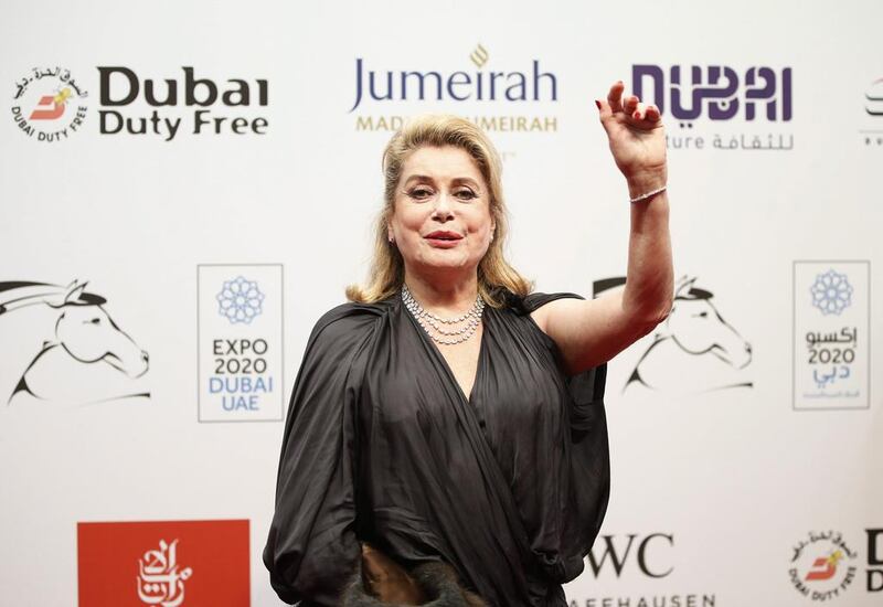 Catherine Deneuve, who was presented a lifetime achievement award, arrives at the opening ceremony of the Dubai International Film Festival. EPA / Ali Haider