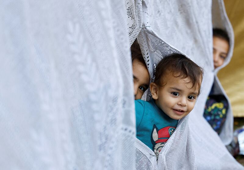 Palestinian children in a makeshift shelter at Al-Shifa hospital in Gaza City. Reuters