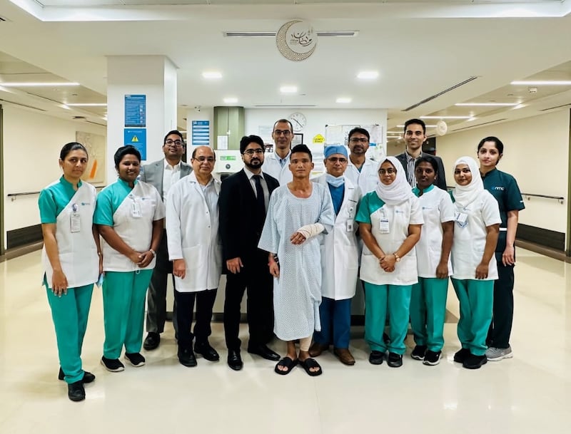 Pyae Phyo Aung surrounded by some of the medical team members who reattached his hand. Photo: NMC Royal Hospital Dubai