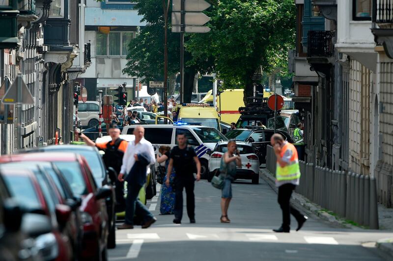 Police and ambulance are seen at the site where an armed man shot and killed police officers before being subdued by police in the eastern Belgian city of Liege on May 29, 2018.   / AFP / JOHN THYS                 
