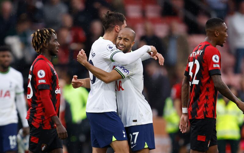 Tottenham's Lucas Moura, right, and Rodrigo Bentancur celebrate at the end of the match. AP