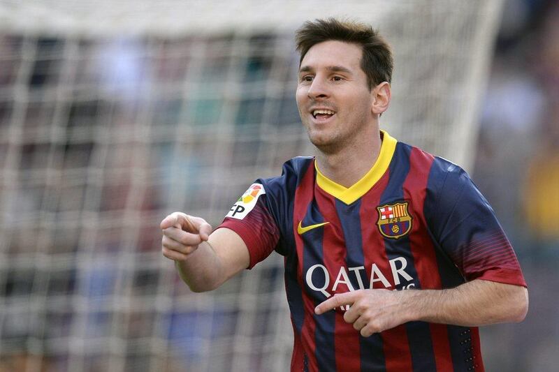 Lionel Messi reacts after scoring one of his three goals against Osasuna on Sunday. Lluis Gene / AFP / March 16, 2014 

