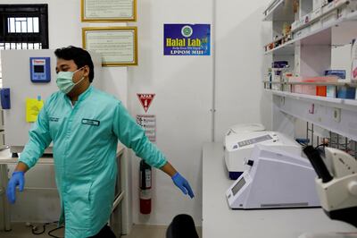 An analyst walks inside the laboratorium of Global Halal Centre, where the Sinovac's vaccine for the coronavirus disease (COVID-19) was analyzed for Halal certification, in Bogor, Indonesia, January 6, 2021. REUTERS/Willy Kurniawan